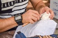 Uncut meerschaum called `lÃÂ¼letaÃÅ¸ÃÂ±` in Turkish in a master`s hand, close up, outdoor photography